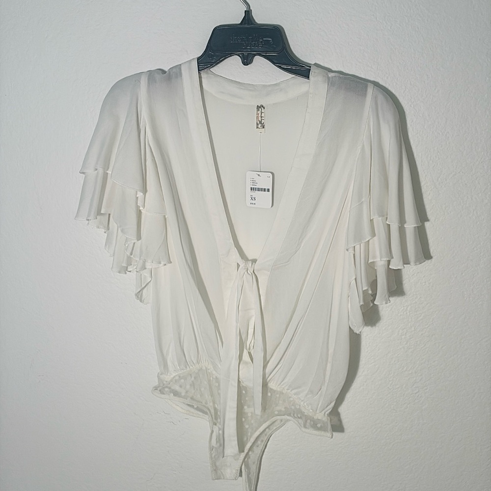 Call Me Later Off-white Tiered Ruffle Plunge Bodysuit by Intimately Free People.